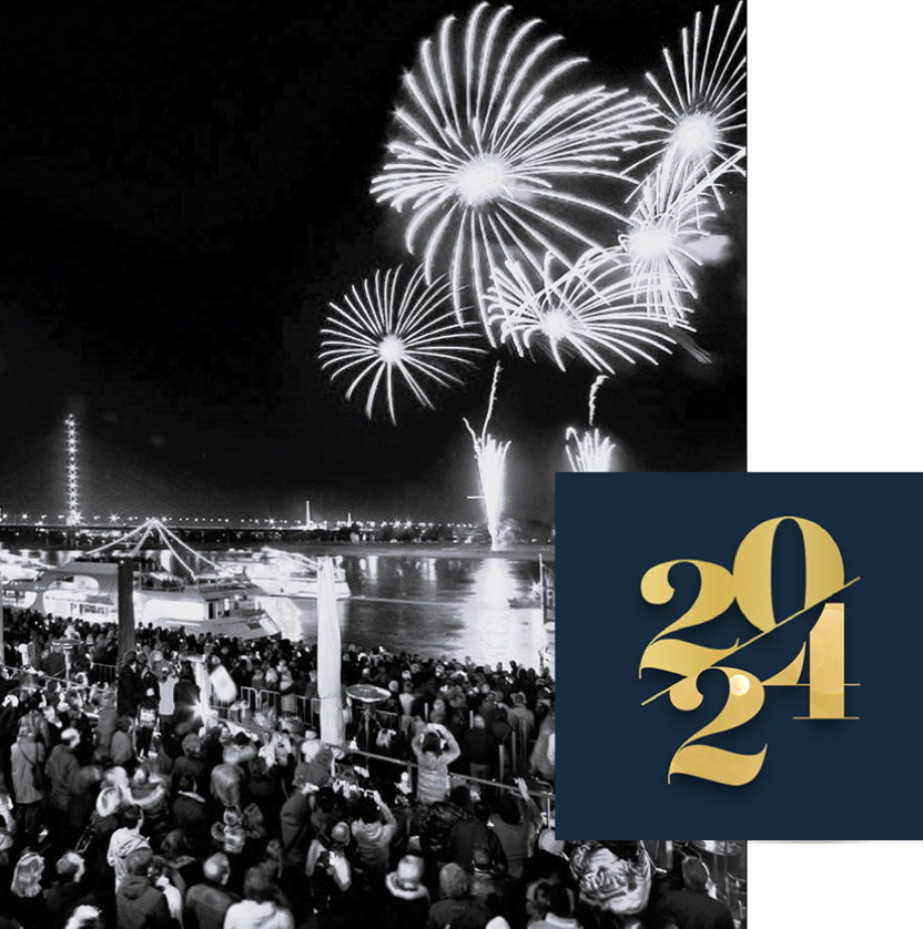 Ein Feuerwerk an den Kasematten am Silvesterabend zeigt das Jahr 2024 in Schwarz-Weiß.